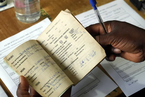 stock image African paediatric hospital. Child health record booklet.  Benin. 