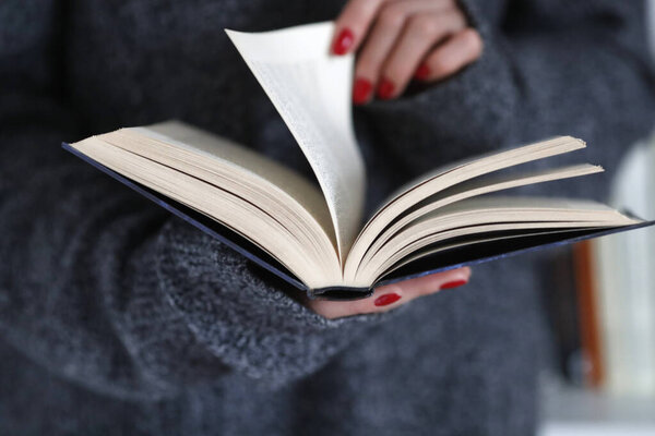 Close-up of woman reading a book. 