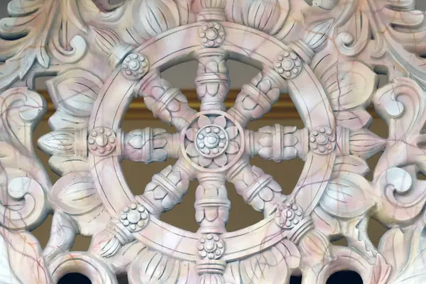 Ba Vang buddhist temple.   Dharma Wheel. Dharmachakra, the Buddhist eight-fold path illustrated in a wheel. Uong Bi. Vietnam.
