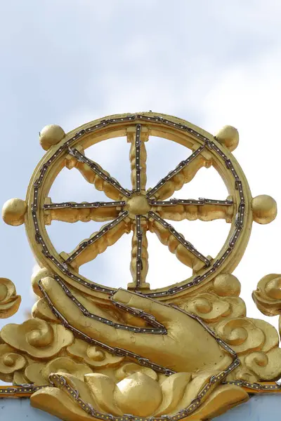 Phuoc Long buddhist temple.  Dharma Wheel. Dharmachakra, the Buddhist eight-fold path illustrated in a wheel. Tan Chau. Vietnam.