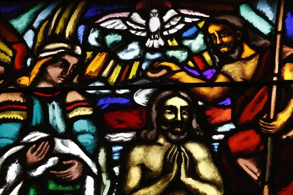 St Joseph church.  Stained glass. The baptism of Christ.    Geneva. Switzerland.
