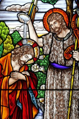 Song Vinh Church. Stained glass.  The baptism of Jesus by John the Baptist.  Vietnam. clipart
