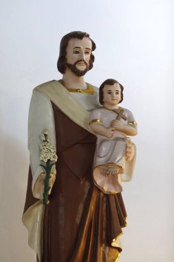 Küçük İsa 'nın kollarında Aziz Joseph. Vietnam.