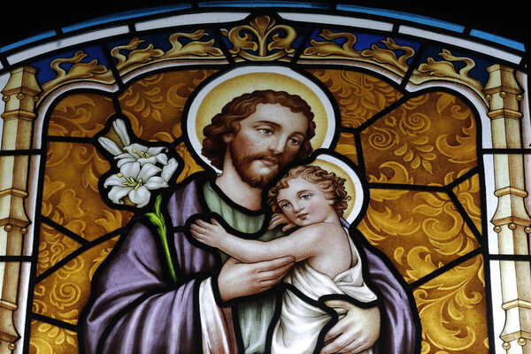 Thi Nghe Church. Stained glass.  Saint Joseph with infant Jesus.  Ho Chi Minh City. Vietnam.