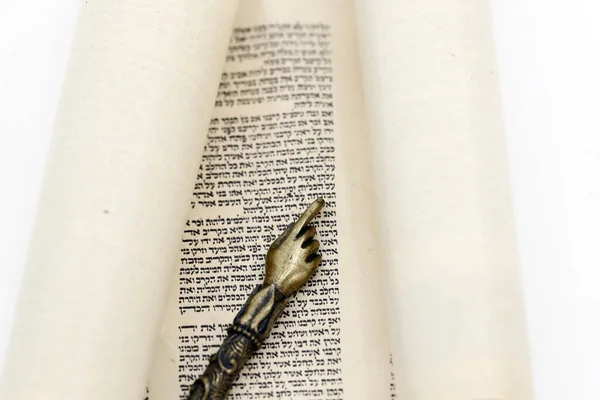 Traditional Torah scroll book and yad. Jewish symbols.