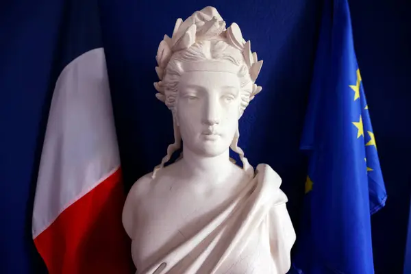 Statue of Marianne with french flag in city hall. Marianne is the national personification of the French Republic. Saint Amour. France.
