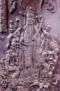 İmparator Jade Pagoda (Chua Ngoc Hoang veya Phuoc Hai Tu). Taoist tapınağı. Tahta oyma panel. Ho Chi Minh şehri. Vietnam. 