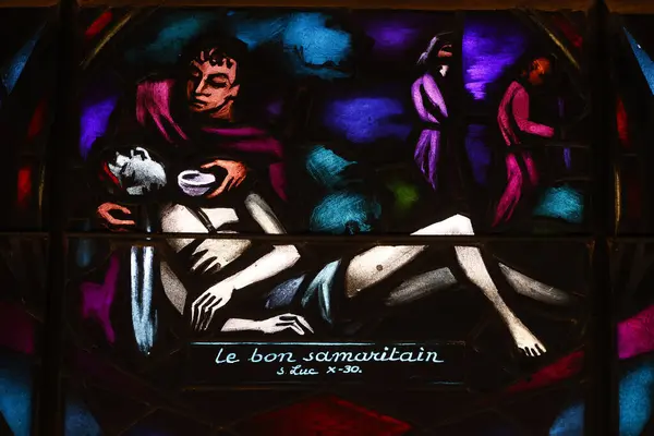stock image Sion cathedral.  Stained glass. The good Samaritan. Luke X 30. Sion. Switzerland. 
