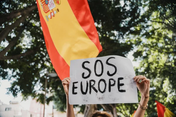 Unrecognizable Protester Holds Banner Text Sos Europe Spanish Flag Background — Stock Photo, Image