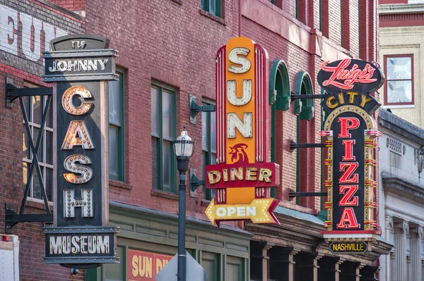 February 13, 2023. Sign for the Johnny Cash Museum and two restaurants.