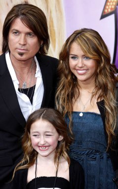 Miley Cyrus and Billy Ray Cyrus at the Los Angeles premiere of 'Hannah Montana The Movie' held at the El Capitan Theater in Hollywood on April 4, 2009.