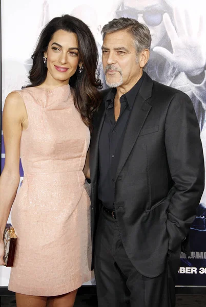 stock image HOLLYWOOD, CA, USA - OCTOBER 26, 2015: Amal Clooney and George Clooney at the Los Angeles premiere of 'Our Brand Is Crisis' held at the TCL Chinese Theatre in Hollywood.