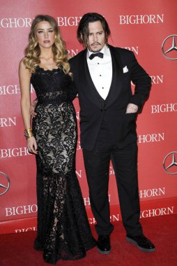 Amber Heard and Johnny Depp at the 27th Annual Palm Springs International Film Festival Awards Gala held at the Palm Springs Convention Center in Palm Springs, USA on January 2, 2016. 