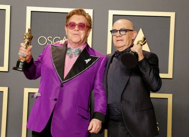 Elton John and Bernie Taupin at the 92nd Academy Awards - Press Room held at the Dolby Theatre in Hollywood, USA on February 9, 2020. clipart