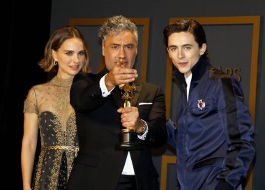 Timothee Chalamet, Natalie Portman, Taika Waititi at the 92nd Academy Awards - Press Room held at the Dolby Theatre in Hollywood, USA on February 9, 2020. clipart