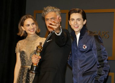 Timothee Chalamet, Natalie Portman, Taika Waititi at the 92nd Academy Awards - Press Room held at the Dolby Theatre in Hollywood, USA on February 9, 2020. clipart