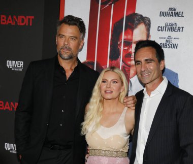 Josh Duhamel, Elisha Cuthbert and Nestor Carbonell at the Los Angeles premiere of 'Bandit' held at the Harmony Gold Theater in Hollywood, USA on September 21, 2022. clipart