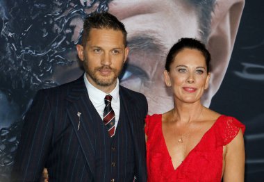 Tom Hardy and Kelly Marcel at the Los Angeles premiere of 'Venom' held at the Regency Village Theatre in Westwood, USA on October 1, 2018. clipart