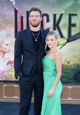 Carson McAllister and Witney Carson at the Los Angeles premiere of 'Wicked' held at the Dorothy Chandler Pavilion in Los Angeles, USA on November 9, 2024. clipart