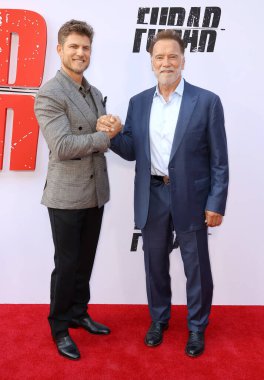 Travis Van Winkle ve Arnold Schwarzenegger Netflix 'in' Fubar 'ikinci sezon galasında 11 Haziran 2025' te Hollywood, ABD 'deki Tudum Tiyatrosu' nda gerçekleştirildi..