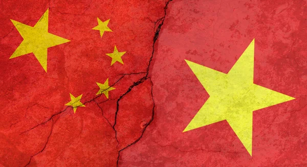 China and Vietnam flags, concrete wall texture with cracks, grunge background, military conflict concept