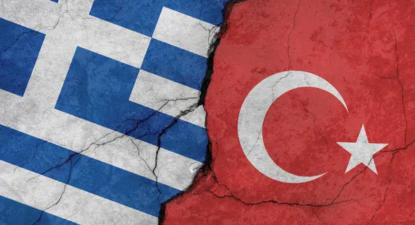 Greece and Turkey flags, concrete wall texture with cracks, grunge background, military conflict concept