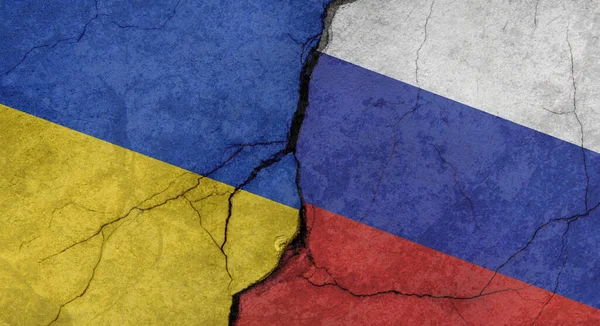 stock image Ukraine and Russia flags, texture of concrete wall with cracks, grunge background, military conflict concept