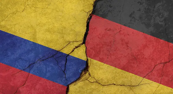 Colombia and Germany flags, concrete wall texture with cracks, grunge background, military conflict concept