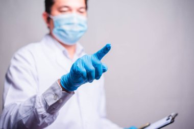 Doctor working with clipboard of medication history records and touch in the air . closeup. Perfect medical service in hospital.