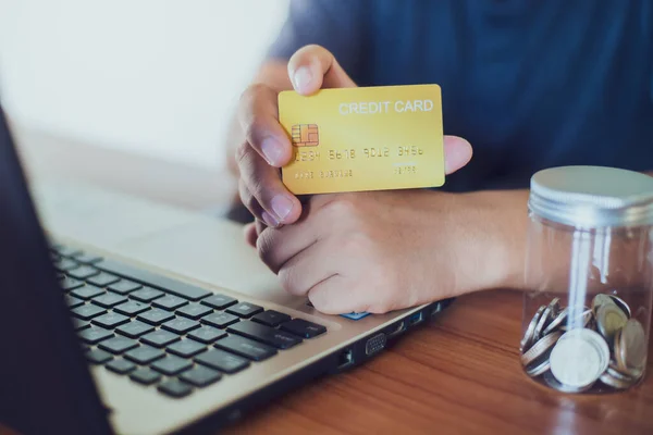 Man Holding Credit Card While Using Laptop Online Shopping Selective Лицензионные Стоковые Изображения