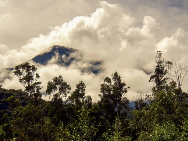Dense clouds and mist half covering the Andean mountains at sunrise near the colonial town of Villa de Leyva in central Colombia.