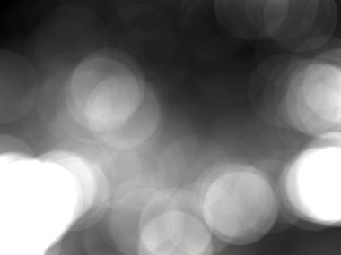 Bulanık arkaplan ve siyah beyaz desenli büyük çember bokeh.