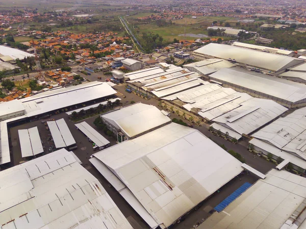 Industrial Photography. Aerial Landscapes. Bird eye view of Factories in the Dwipapuri Industrial Sector, Located in Rancaekek, Bandung - Indonesia. Aerial Shot from a flying drone.
