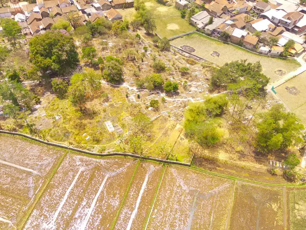 Aerial Photography. Aerial Landscapes. Top view of a public cemetery on the edge of Bandung city - Indonesia. Aerial Shot from a flying drone.