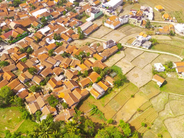 Landscape Photography. Aerial Landscapes. Aerial View of Beautiful Countryside with Patchwork Landscape and Village, Located in Rancaekek, Bandung - Indonesia. Aerial Shot from a flying drone.