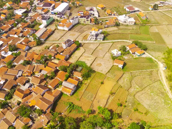 Landscape Photography. Aerial Landscapes. Aerial View of Beautiful Countryside with Patchwork Landscape and Village, Located in Rancaekek, Bandung - Indonesia. Aerial Shot from a flying drone.