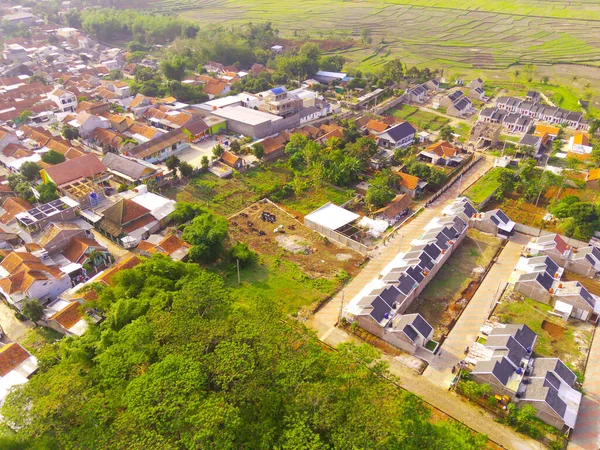 Top view Small Housing. Aerial Photography. Aerial panorama over small isolated housing complex. Shot from a drone flying 200 meters high. Cikancung, Indonesia