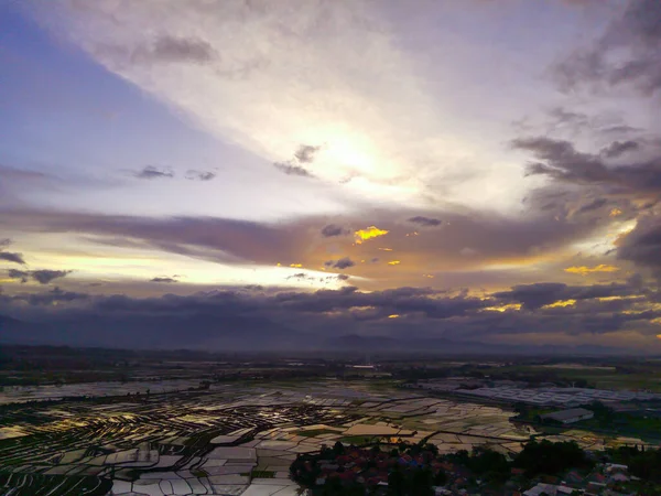 Sunset View. Aerial Photography. Picturesque Panoramic Aerial sky in the afternoon. Shot from a drone flying 200 meters high. Cikancung, Indonesia