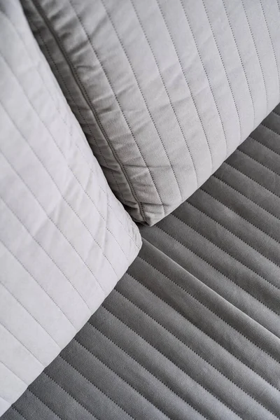 closeup of textile upholstery on comfortable couch in living room at modern apartment, repair and restoration furniture concept, dry cleaning service