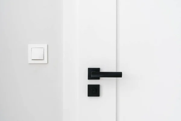 Closeup Black Metal Handle Lock Closed White Door Light Switch — Stock Photo, Image