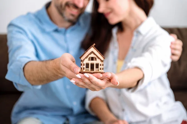 Property protection, insurance, mortgage loan, home purchase, concept. Woman and man move in new house together. Happy owners of flat, apartment.