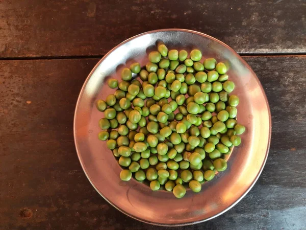 stock image Fresh Green peas. There is a lot of vitamins  and Minerals in it. Thepeais most commonly the small sphericalseedor the seed.