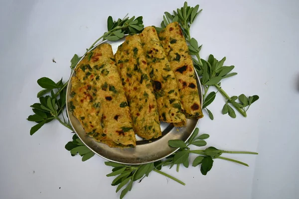 Methi paratha or fenugreek flatbread. It is made from wheat flour and fenugreek leaves. Healthy Indian breakfast, lunch or dinner. Popular indian food.