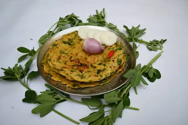Methi paratha or fenugreek flatbread. It is made from wheat flour and fenugreek leaves. Healthy Indian breakfast, lunch or dinner. Popular indian food.