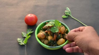 Aloo Methi or Fenugreek potato vegetable. It is made with fresh fenugreek leaves and potatoes. Indian homemade traditional Aalu Methi dry curry. Fenugreek potato sabzi  is healthy Indian Cuisine.