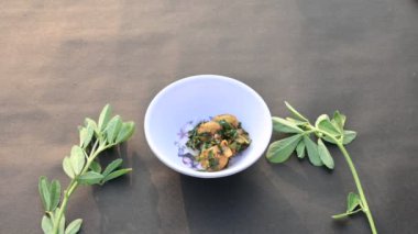 Aloo Methi or Fenugreek potato vegetable. It is made with fresh fenugreek leaves and potatoes. Indian homemade traditional Aalu Methi dry curry. Fenugreek potato sabzi  is healthy Indian Cuisine.