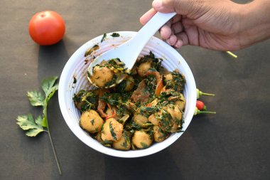 Aloo Methi or Fenugreek potato vegetable. It is made with fresh fenugreek leaves and potatoes. Indian homemade traditional Aalu Methi dry curry. Fenugreek potato sabzi  is healthy Indian Cuisine.