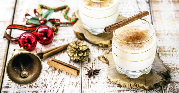 winter drink made with eggs, liqueur and cinnamon, called eggnog, coquito or Auld Man\'s milk, winter hot drink