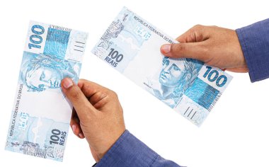 Brezilya parası, yüz elli reais banknot, Brezilya ekonomisi teklif eden izole beyaz arka plan üzerine el..