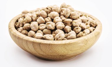 raw chickpeas on white background isolated inside rustic wooden bowl, Brazillian tipical food